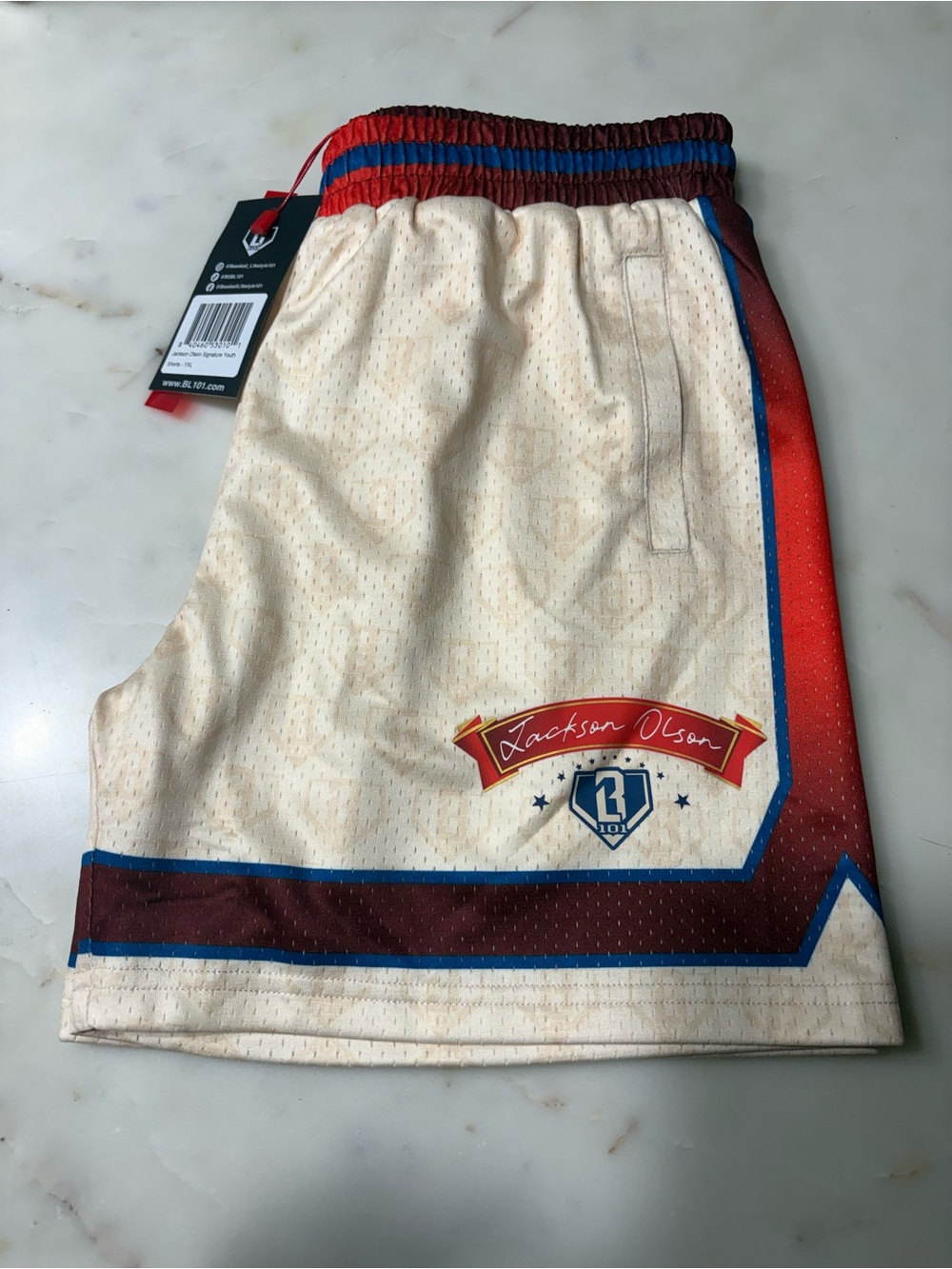 Jackson Olson Cream Athletic Shorts with Red & Blue Trim